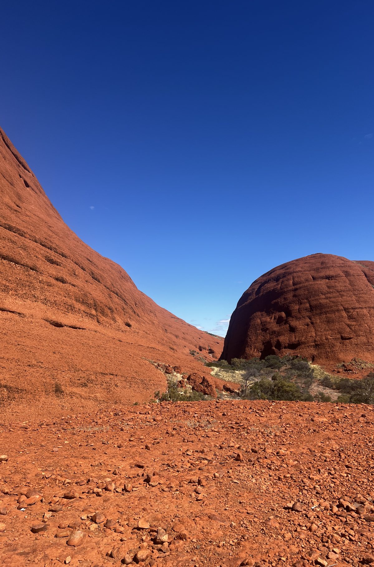 Red rock rising against open sky