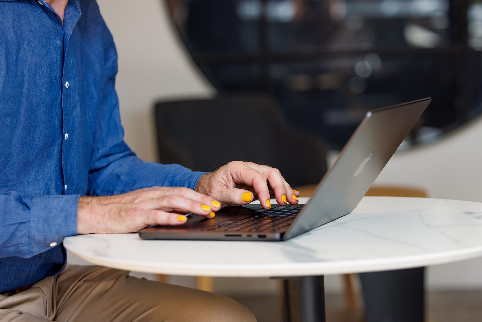 Dr Brad Hodge working at a laptop